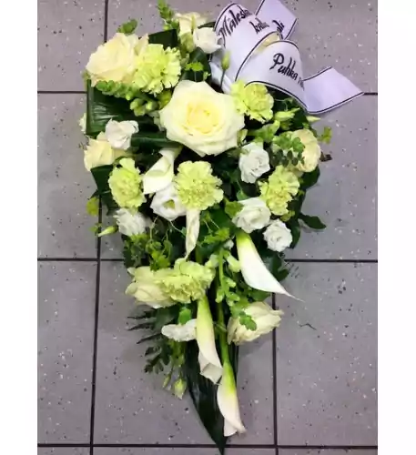 Funeral arrangement: White roses, lisianthus and callas