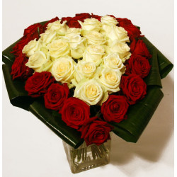 Heart-shaped bouquet of red and white roses