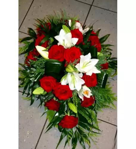 Funeral arrangement: red roses and white lilys