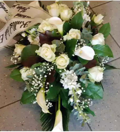 Funeral arrangement: white callas and roses