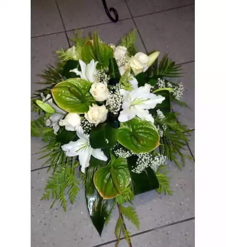 Funeral arrangement of white roses, lilys and anthuriums