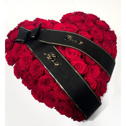 Heart-shaped arrangement for the funeral (red roses)