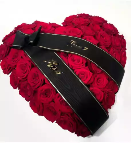 Heart-shaped arrangement for the funeral (red roses)