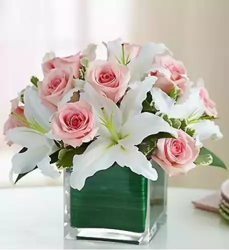 Low Arrangement Of Pink Roses And White Lilium